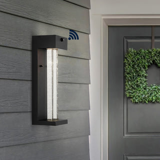 Miranda 5.13" Modern Industrial Iron/Glass Seeded Glass with Dusk-to-Dawn Sensor Integrated LED Outdoor Sconce - JONATHAN Y