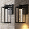 Juno 4.75" Industrial Vintage Iron/Glass Seeded Glass with Dusk-to-Dawn Sensor Integrated LED Outdoor Sconce